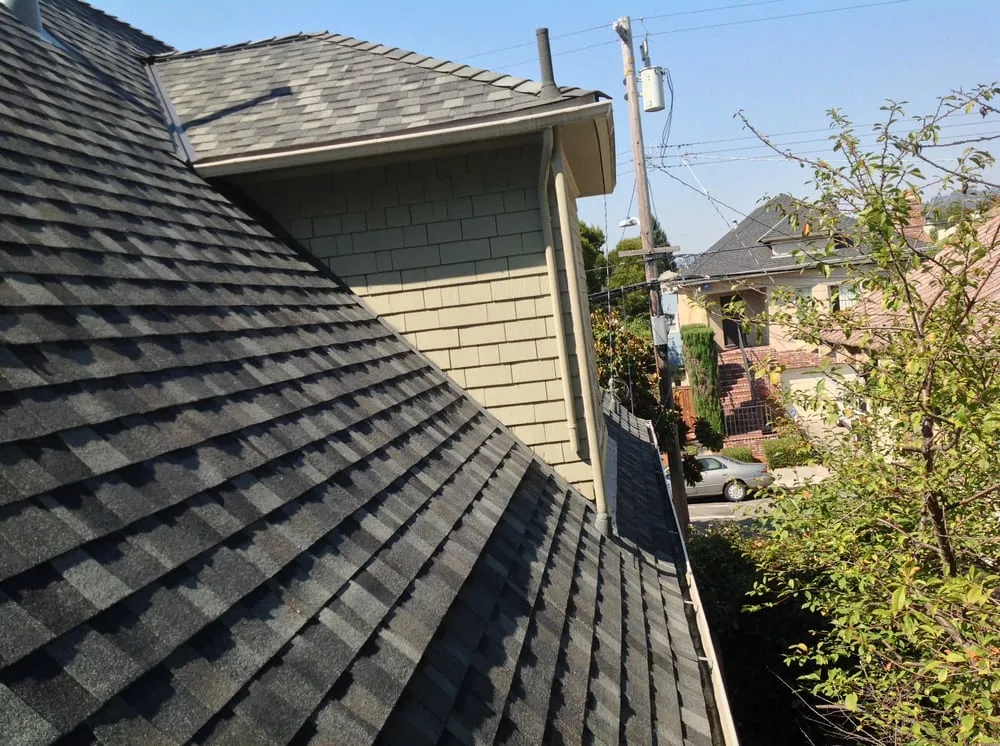 View of a roof with gray shingles installed by Roofing Logistics, Inc. in Oakland.